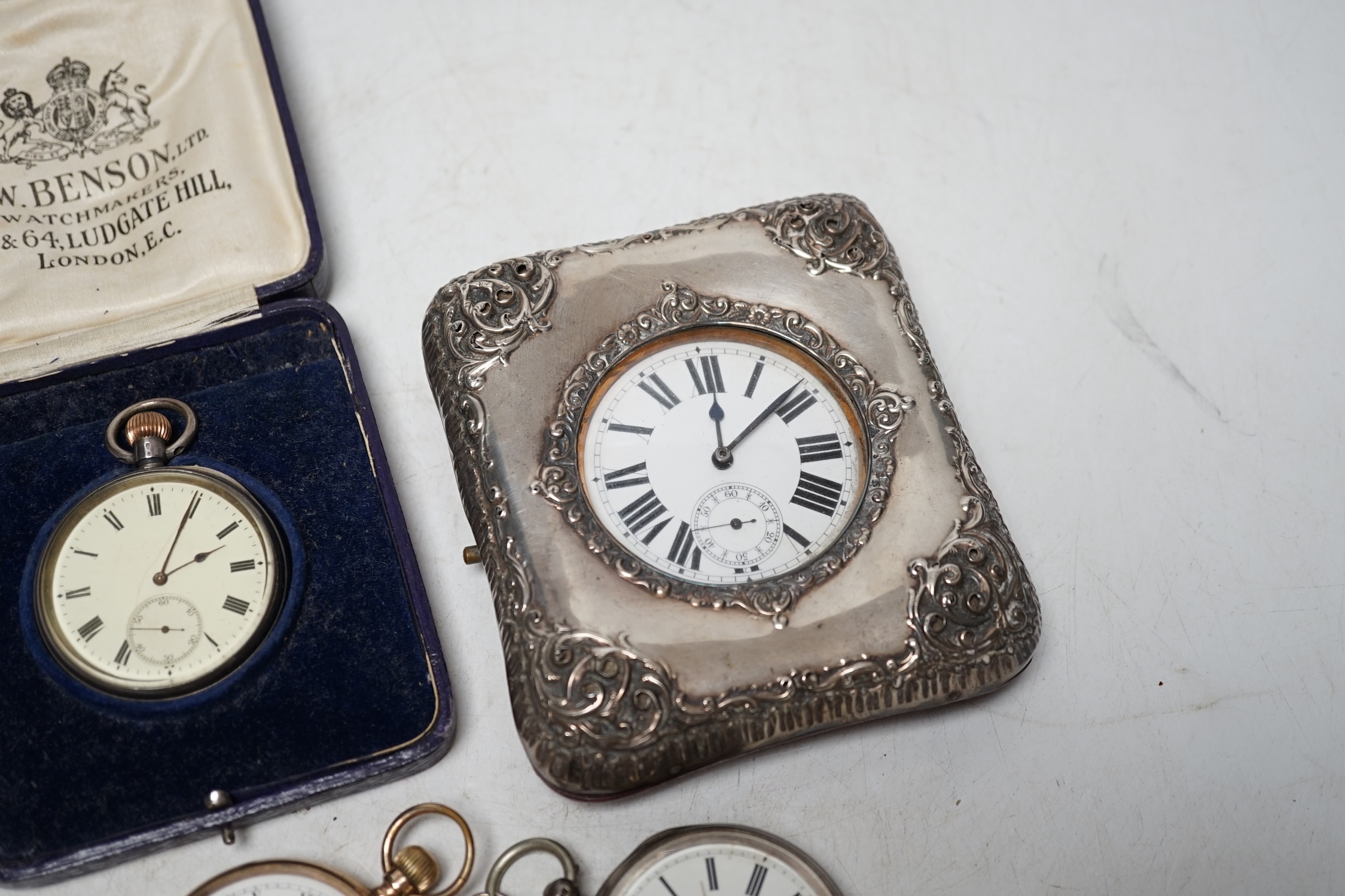 A George V repousse silver mounted travelling watch case (a.f.), with pocket watch, three silver open face pocket watches and a Waltham gold plated pocket watch. Condition - poor to fair